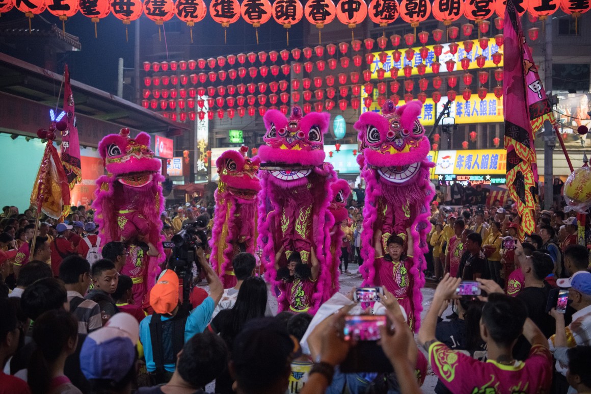 Lion dancers perform at Jenn Lann Temple during festivities marking the end of the nine-day Mazu Pilgrimage, on April 22nd, 2018, in Dajia near Taichung, Taiwan. The annual Mazu Pilgrimage begins at Jenn Lann Temple in Taichung and sees around 200,000 pilgrims walk up to 12 hours each day for nine days carrying a statue of Chinese sea goddess Mazu in a sedan chair. The journey covers around 350 kilometers, much of it through mountainous and rugged terrain, and visits more than 100 temples before returning to Taichung.