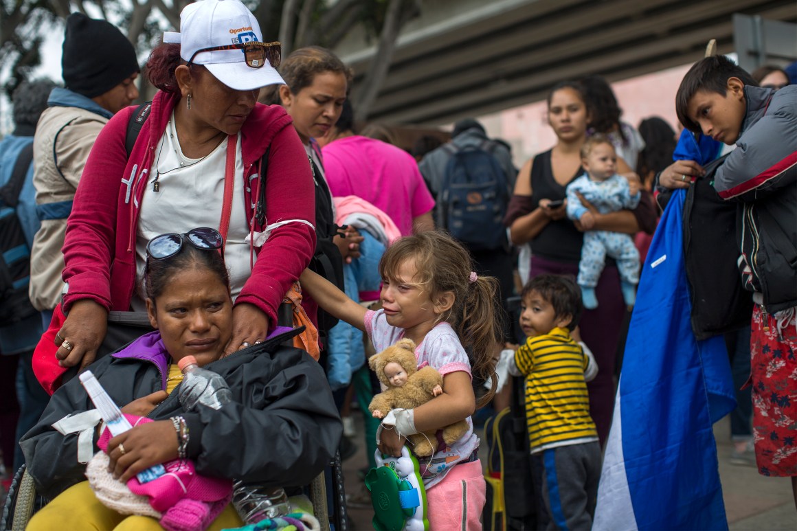 Members of a caravan of Central Americans who spent weeks traveling across Mexico walk from Mexico to the U.S. side of the border to ask authorities for asylum on April 29th, 2018 in Tijuana, Baja California Norte, Mexico.