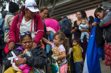 Members of a caravan of Central Americans who spent weeks traveling across Mexico walk from Mexico to the U.S. side of the border to ask authorities for asylum on April 29th, 2018 in Tijuana, Baja California Norte, Mexico.