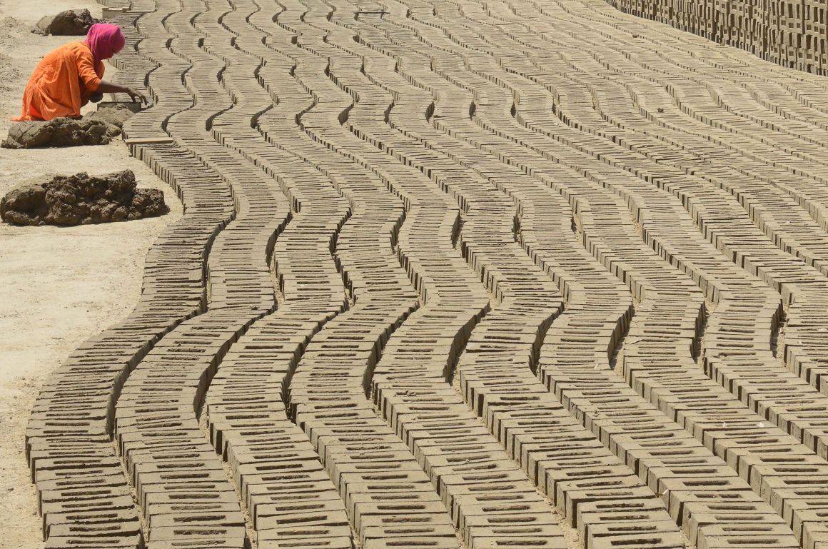 An Indian laborer works in a brick kiln on the outskirts of Amritsar on April 30th, 2018, ahead of International Labor Day.