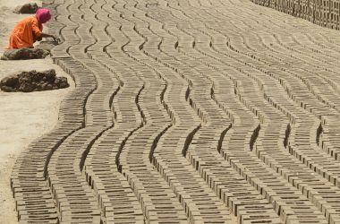 An Indian laborer works in a brick kiln on the outskirts of Amritsar on April 30th, 2018, ahead of International Labor Day.