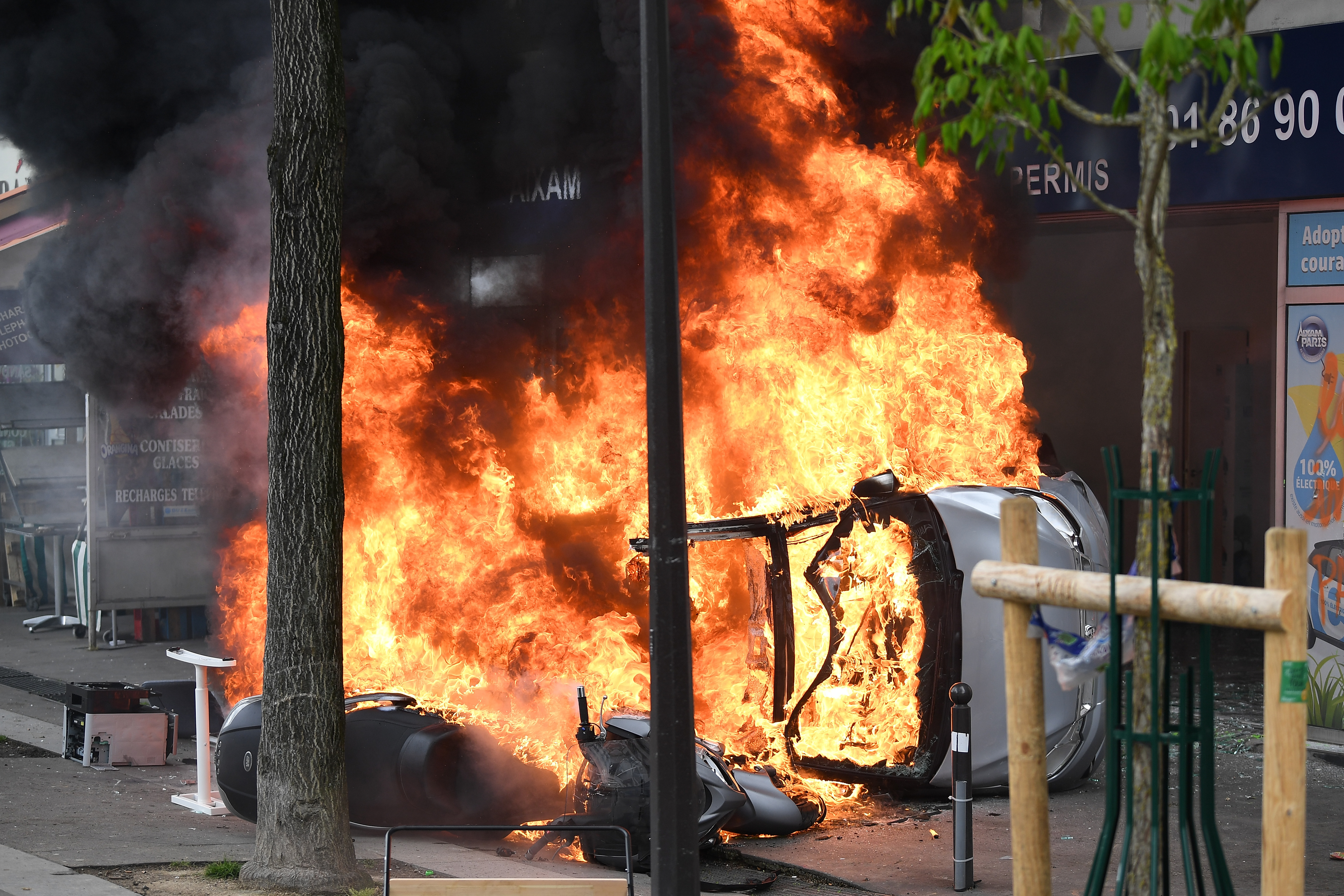 Vehicles are burned as thousands of people take to the streets during the May Day demonstrations on May 1st, 2018, in Paris, France.