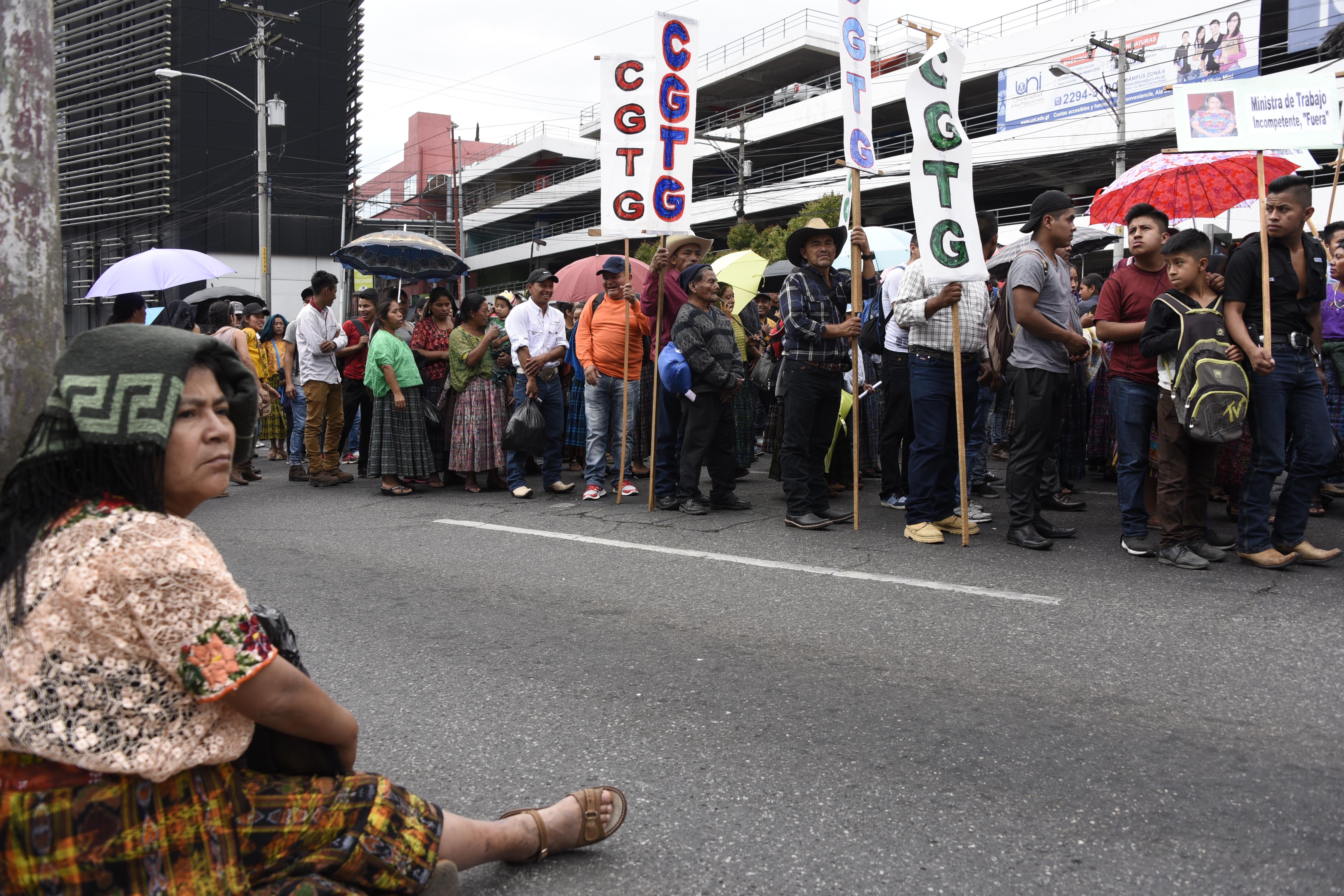 Workers march during a May Day rally in Guatemala City, Guatemala, on May 1st, 2018. Thousands of marching workers demanded the resignation of President Jimmy Morales, who faces allegations of campaign finance corruption.