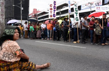 Workers march during a May Day rally in Guatemala City, Guatemala, on May 1st, 2018. Thousands of marching workers demanded the resignation of President Jimmy Morales, who faces allegations of campaign finance corruption.