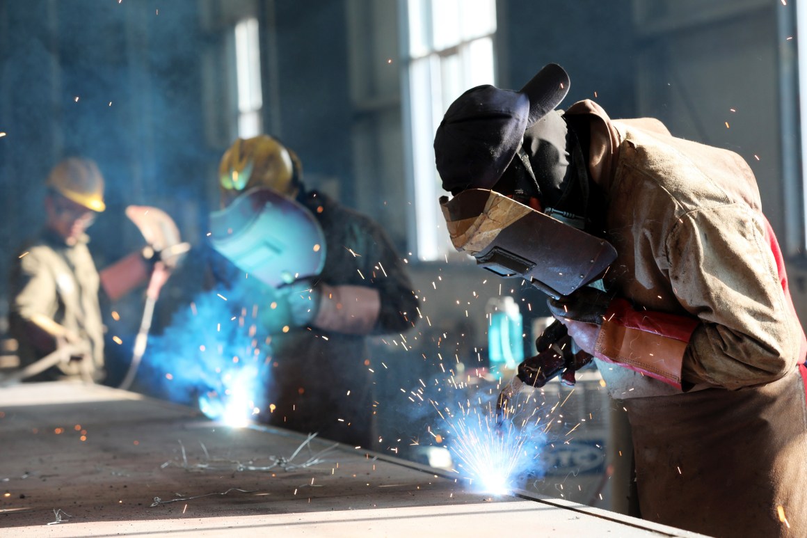 This photo taken on May 3rd, 2018, shows a worker cutting steel at a factory in Huaibei in China's eastern Anhui province.