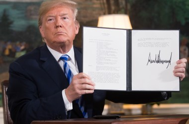 President Donald Trump signs a document reinstating sanctions against Iran after announcing the U.S. withdrawal from the Iran nuclear deal at the White House on May 8th, 2018.