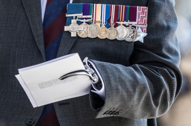 Major Peter Norton GC grips a program in his prosthetic hand as he waits to greet Prince Charles, Prince of Wales (not seen) at the door as he attends the bi-annual service of the Victoria Cross and George Cross Association at St Martin-in-the-Fields on May 15th, 2018, in London, England. Major Norton lost an arm and a leg while leading an EOD team in Iraq in 2005.