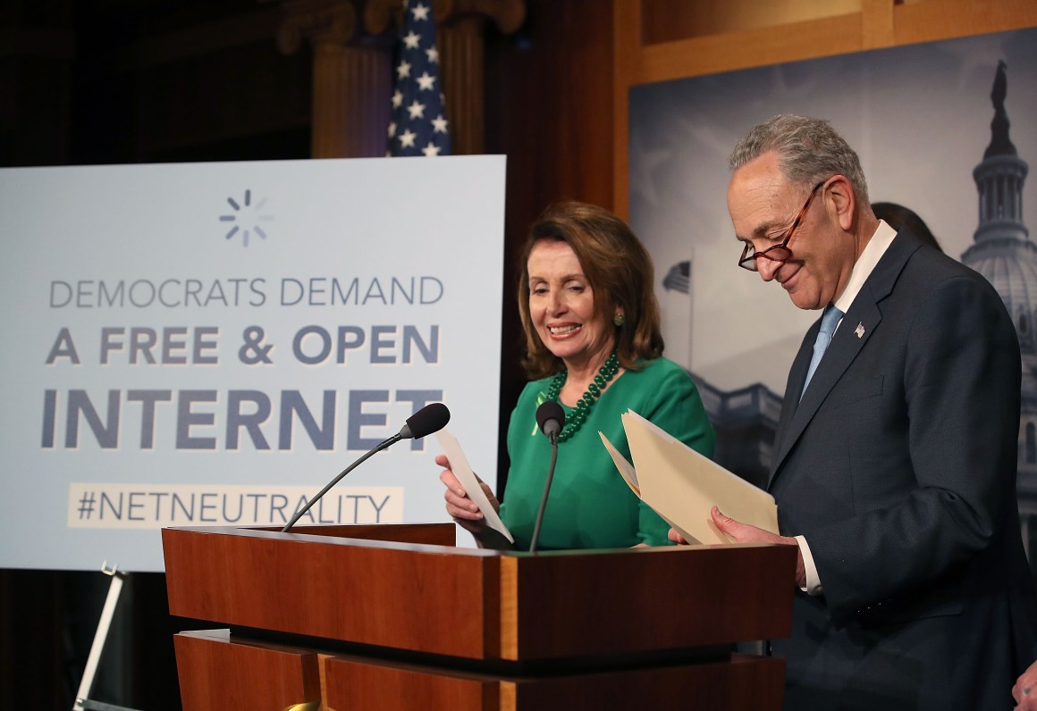 Senate Majority Leader Charles Schumer speaks at a press conference on May 16th, 2018, in Washington, D.C., as House Minority Leader Nancy Pelosi looks on.