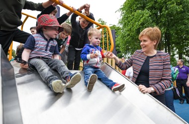 First Minister Nicola Sturgeon holds the hand of two-year-old Jamie McGuiness as she officially opens Play as One Scotland's fully inclusive play park on June 4th, 2018, in Dunfermline, Scotland. The play park has been specially designed for both non-disabled children and children with physical and learning difficulties and is the largest of its kind in Scotland.