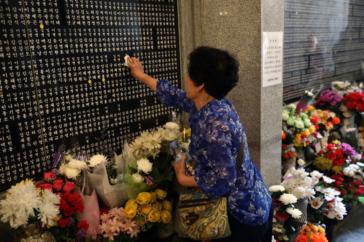 A South Korean woman touches the engraved name of her older brother who died during the Korean War at Seoul National Cemetery on June 6th, 2018, in Seoul, South Korea. South Korean President Moon Jae-in said on Wednesday that his country will push for recovery of remains of the fallen soldiers who died during the 1950-53 Korean War. South Korea marked its 63rd Memorial Day anniversary amid emerging improved relations with the Democratic People's Republic of Korea as the first-ever U.S.-DPRK summit has been scheduled for June 12th in Singapore.