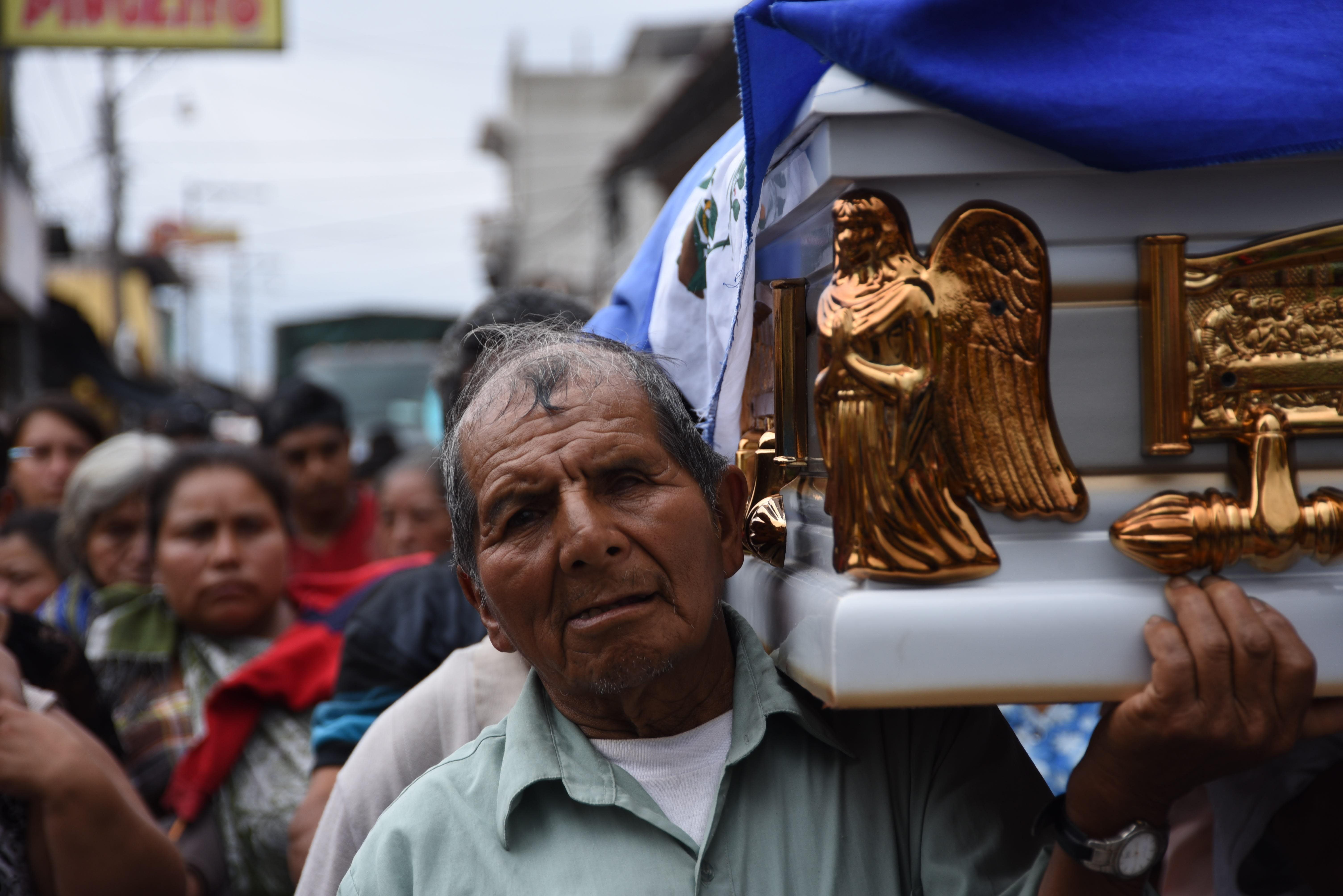 Relatives and residents carry the coffin of 20-year-old Erick Rivas, who died following the eruption of the Fuego volcano, during his funeral in Alotenango municipality, Sacatepequez, about 65 kilometers southwest of Guatemala City, on June 6th, 2018.