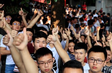 Candidates cheer for themselves before sitting the National College Entrance Examination (a.k.a. Gaokao) outside an exam site on June 7th, 2018, in Luzhou, Sichuan Province of China. About 9.75 million Chinese high school students will take the 2018 National College Entrance Examination.