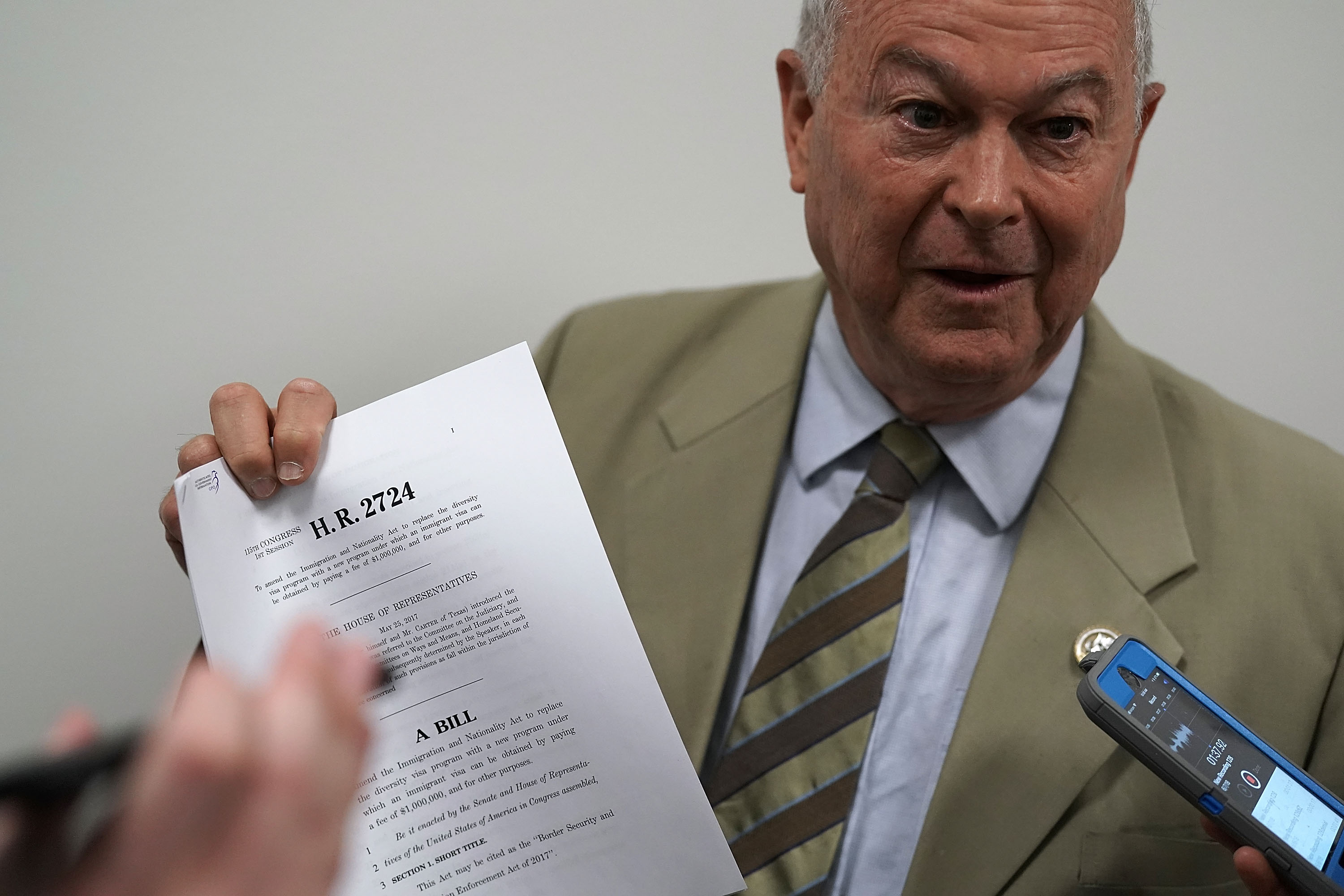 Dana Rohrabacher speaks to members of the media as he leaves a Republican conference meeting on June 7th, 2018, in Washington, D.C.