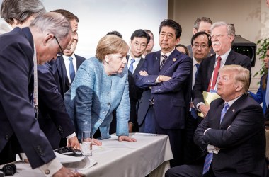 German Chancellor Angela Merkel speaks with President Donald Trump on the second day of the G7 summit on June 9th, 2018, in Charlevoix, Canada.