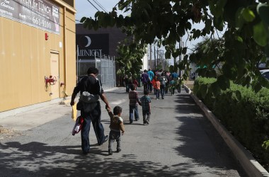 Central American immigrant families depart ICE custody pending future immigration court hearings on June 11th, 2018, in McAllen, Texas.