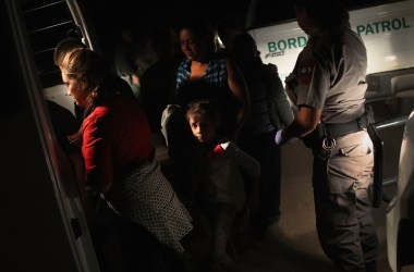 U.S. Border Patrol agents detain a group of Central American asylum seekers near the U.S.-Mexico border on June 12th, 2018 in McAllen, Texas.