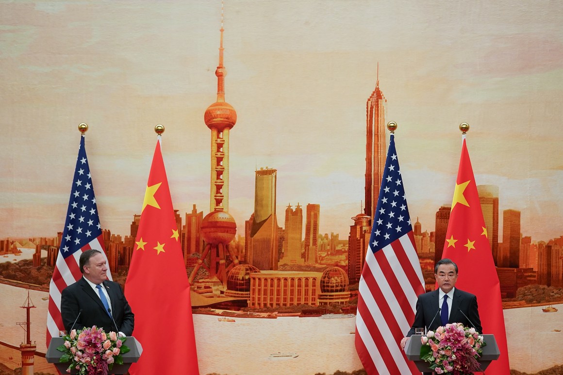 Chinese Foreign Minister Wang Yi (R) speaks during a press conference with U.S. Secretary of State Mike Pompeo.