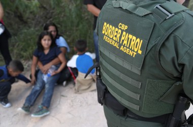 Central American asylum seekers wait as U.S. Border Patrol agents take them into custody on June 12th, 2018, near McAllen, Texas.