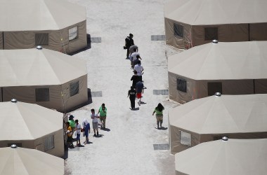 Children and workers are seen at a tent encampment recently built near the Tornillo Port of Entry on June 19th, 2018, in Tornillo, Texas.