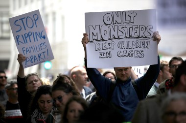 Protesters hold signs during a demonstration outside of the San Francisco office of the Immigration and Customs Enforcement on June 19th, 2018.