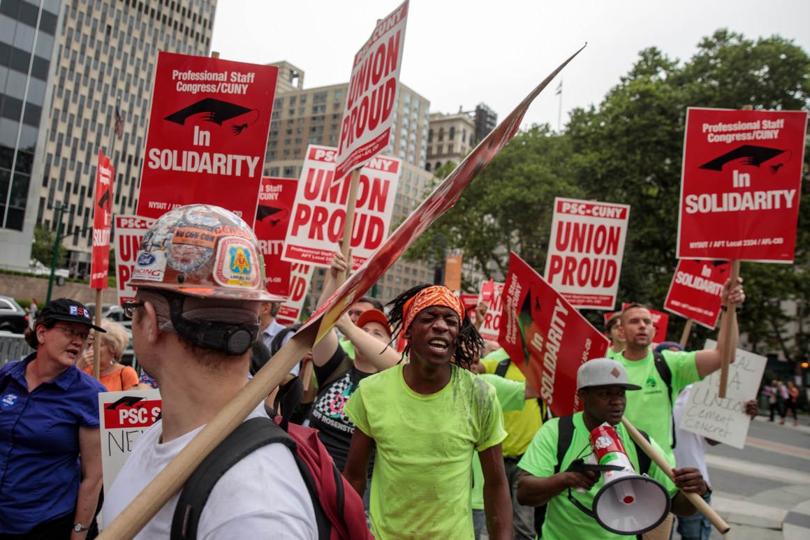 Union activists and supporters rally against the Supreme Court's ruling in the Janus v. AFSCME case.