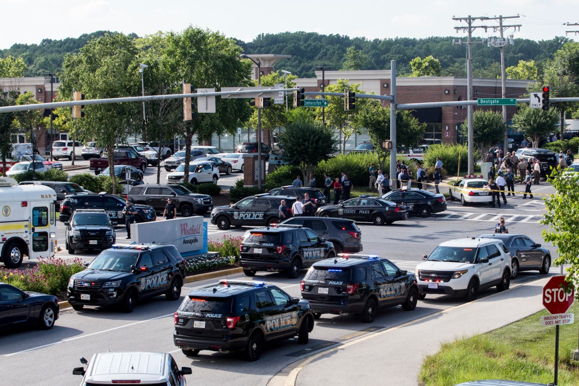 Police respond to a shooting on June 28th, 2018, in Annapolis, Maryland. At least five people were killed Thursday when a gunman opened fire inside the offices of the Capital Gazette, a newspaper published in Annapolis, a historic city an hour east of Washington. A reporter for the daily, Phil Davis, tweeted that a "gunman shot through the glass door to the office and opened fire on multiple employees. There is nothing more terrifying than hearing multiple people get shot while you're under your desk and then hear the gunman reload."