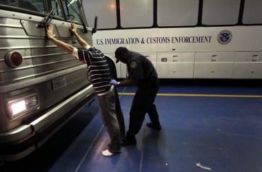 A man is searched while being in-processed at the Immigration and Customs Enforcement center on April 28th, 2010, in Phoenix, Arizona.