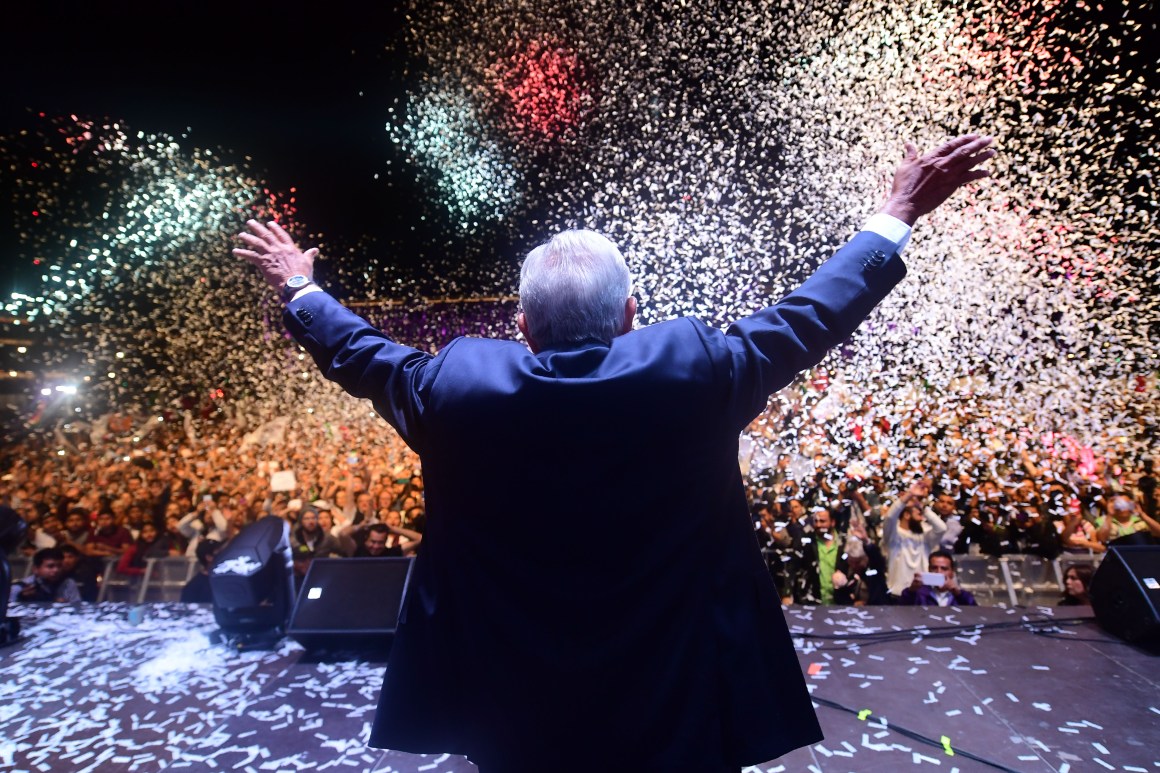 Mexico's newly elected President Andres Manuel Lopez Obrador, representing the Juntos Haremos Historia Party, cheers his supporters at the Zocalo Square after winning general elections, in Mexico City, on July 1st, 2018.