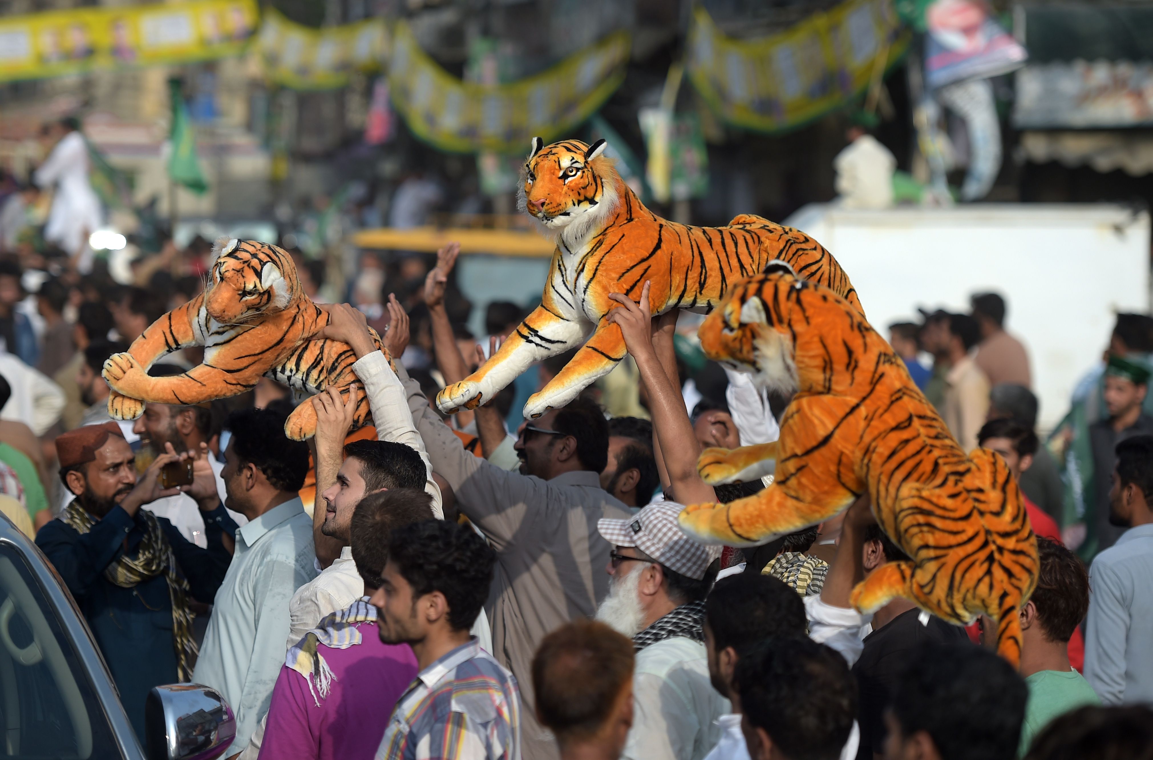 Protesters and supporters flood the locked-down streets of Lahore on July 13th for the return of Sharif, who faces a 10-year prison sentence ahead of already-tense elections that his party insists are being rigged.