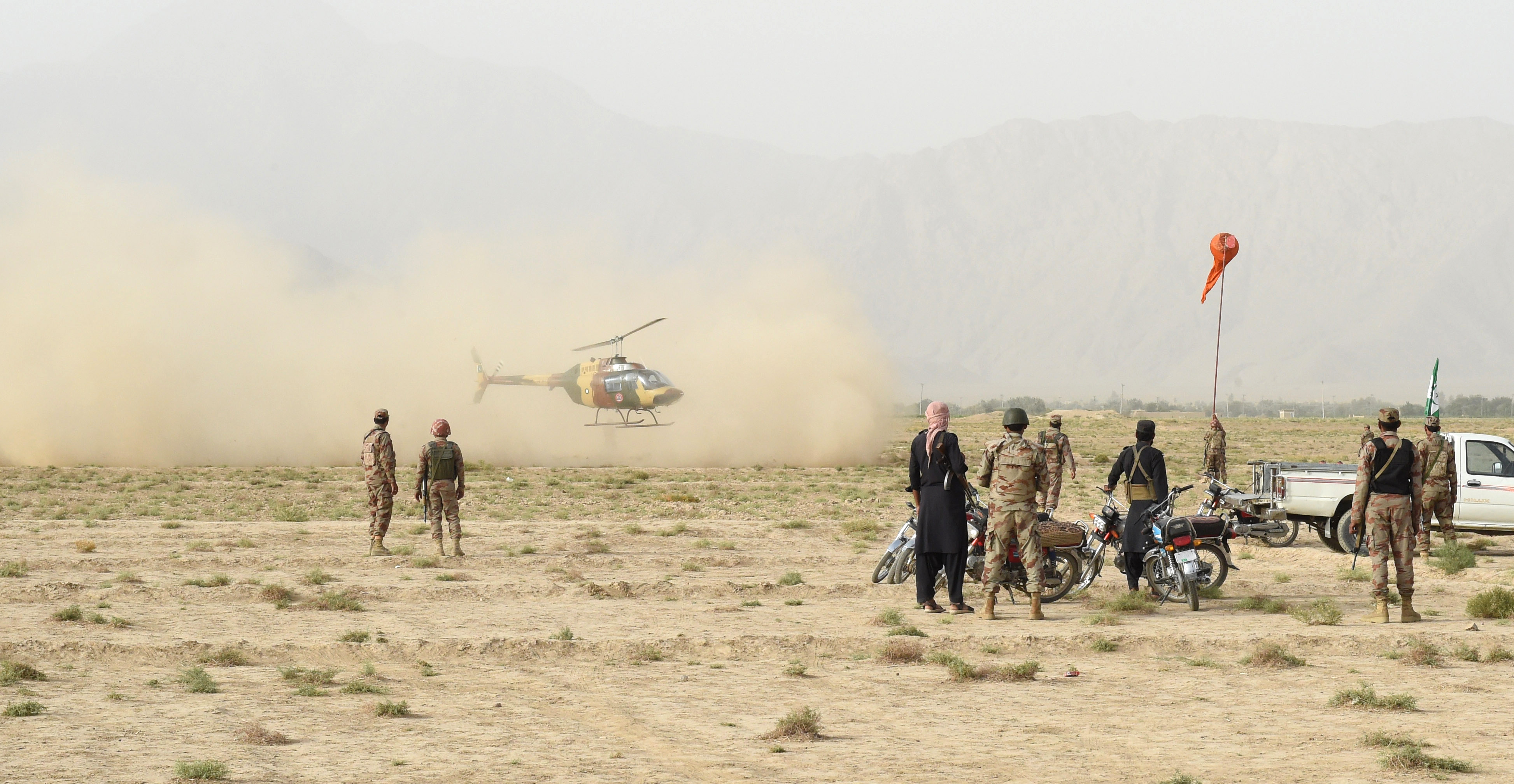 Pakistani Frontier Constabulary personnel gather in Mastung on July 13th, 2018, following a bomb blast at an election rally.