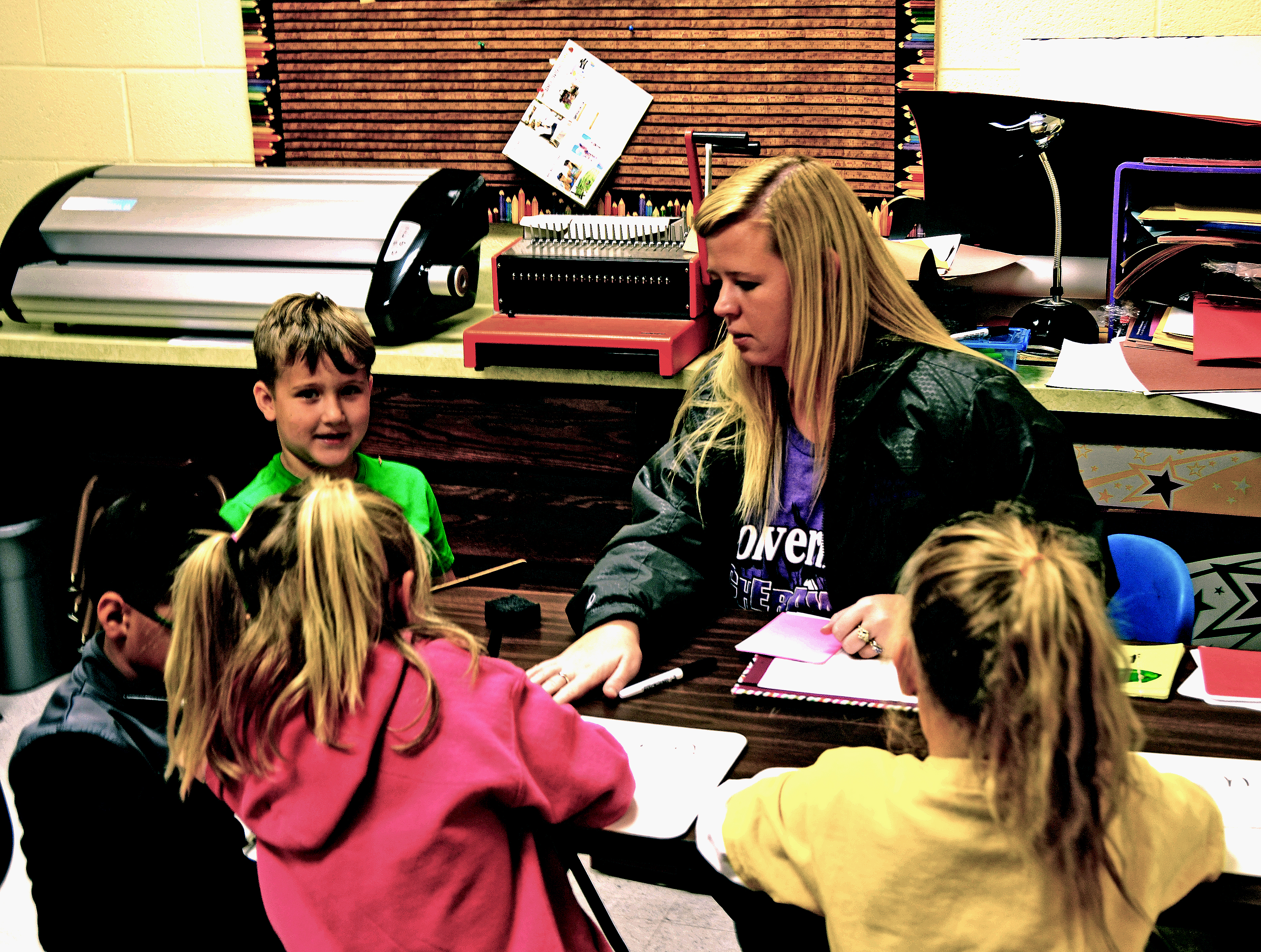 Kindergartners get help with reading in Cheraw, Colorado. The district is working to improve results at its elementary school, which has been underperforming.