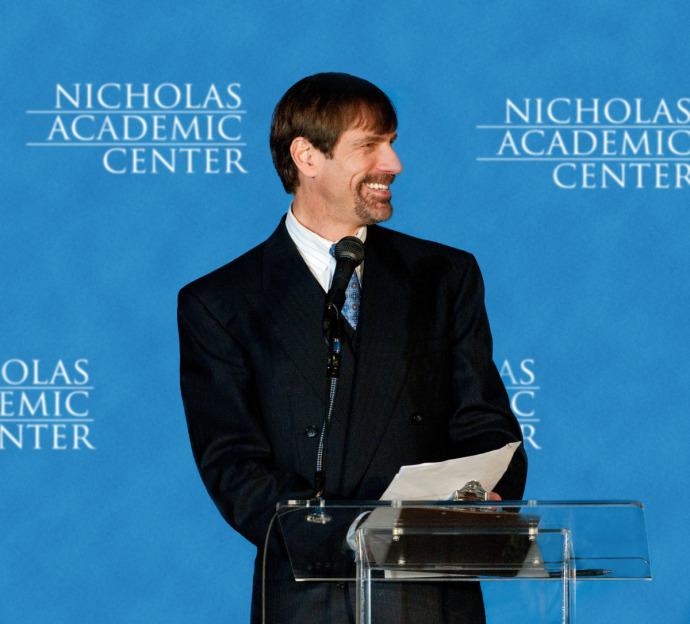 Henry Nicholas addressing Nicholas Academic Center graduates.