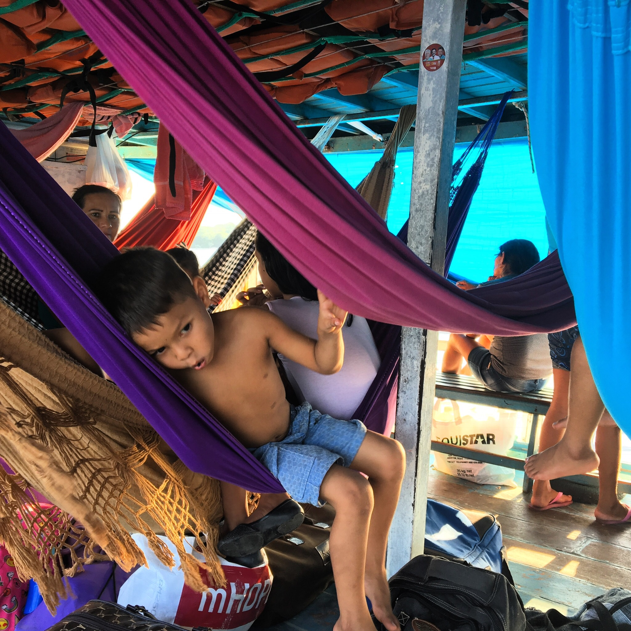 The Michael was brimming with people on their way to vote in the presidential election. Each person set up a hammock on the boat, which became a kind of home base for the long hours of travel.