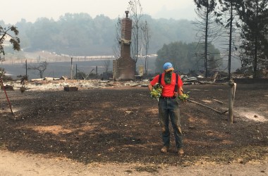 Farm employee Zebulon Siegel holds salvaged produce at Oak Hill Farm following the 2017 fires in Sonoma County, California.