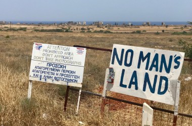 Signs mark fenced-off areas of Varosha, a quarter in the city of Famagusta, Cyprus, which until 1974 was a popular seaside resort. The buildings seen in the background are abandoned beach hotels that attracted Hollywood movie stars until the country's division.