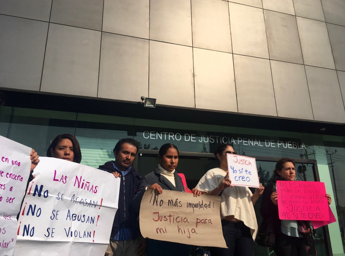 Sonia Escobar (center) stands with activist Natali Arias (left) and other supporters on the first day of her daughter’s hearing at the Centro Justicia Penal in Puebla, Mexico, on April 30th, 2018.