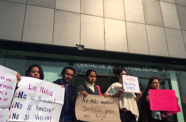 Sonia Escobar (center) stands with activist Natali Arias (left) and other supporters on the first day of her daughter’s hearing at the Centro Justicia Penal in Puebla, Mexico, on April 30th, 2018.