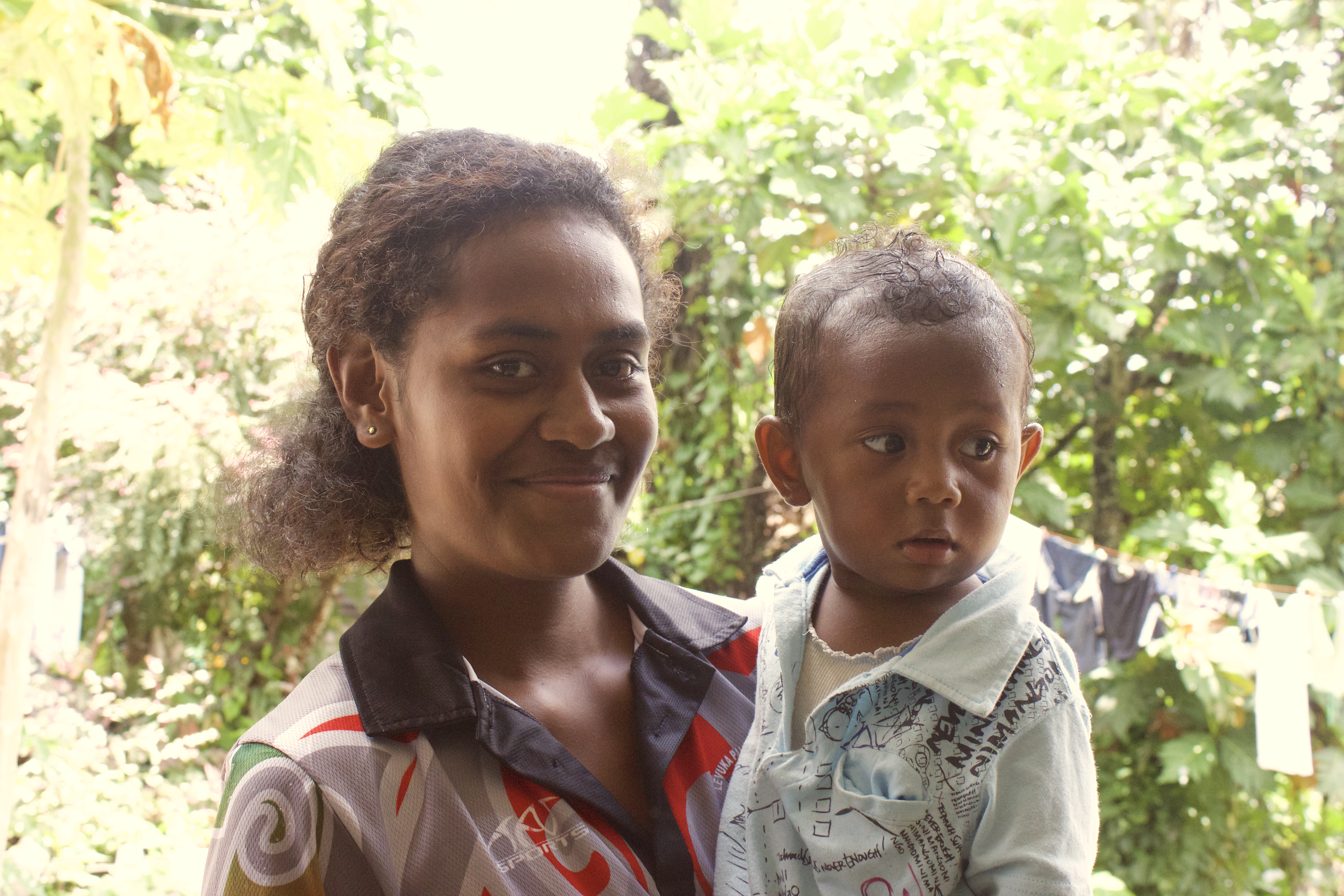 A toddler with his mother in the hills above Levuka.