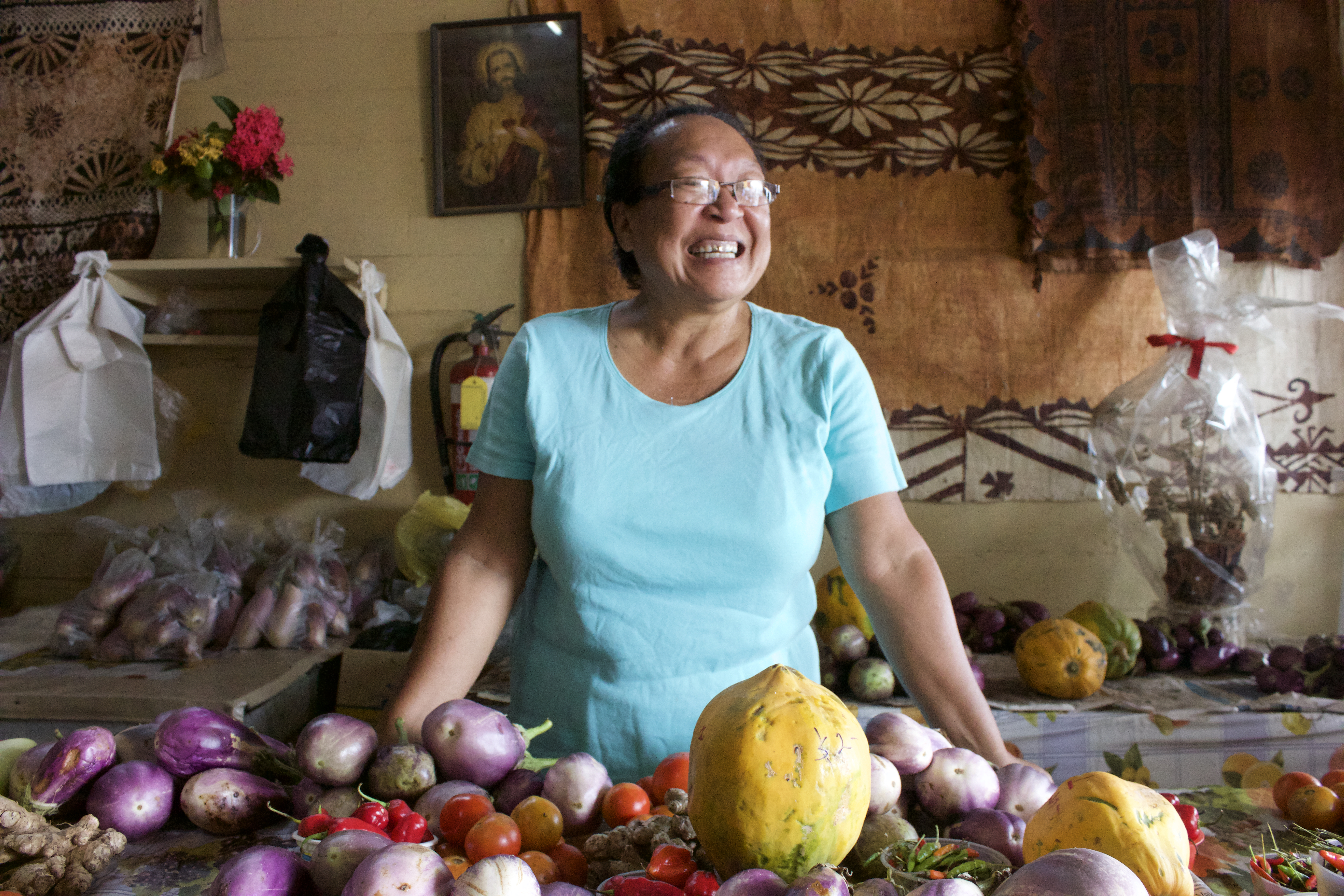 Teresa Yee Show presiding over a vegetable counter at the market in Levuka.