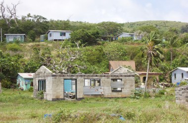 In the village of Nacamaki remains of old houses in the low-lying coastal village sit near new houses on the hills above.