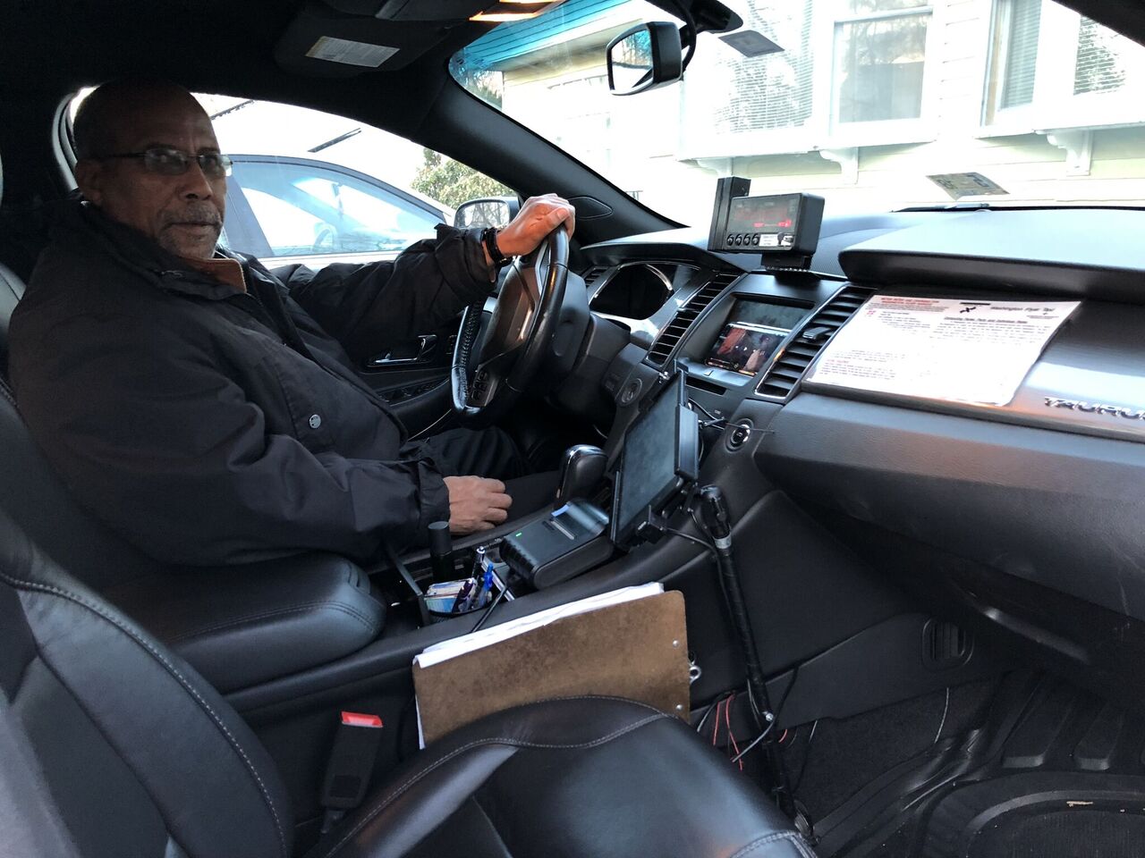 Hailu Mergia driving his taxi.