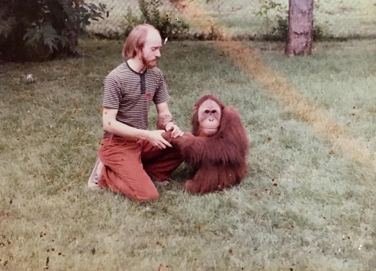 A young Dick Haskin, recently graduated from the University of Nebraska–Lincoln, works with Chewy, a sumatran orangutan, at the Lincoln Children’s Zoo.