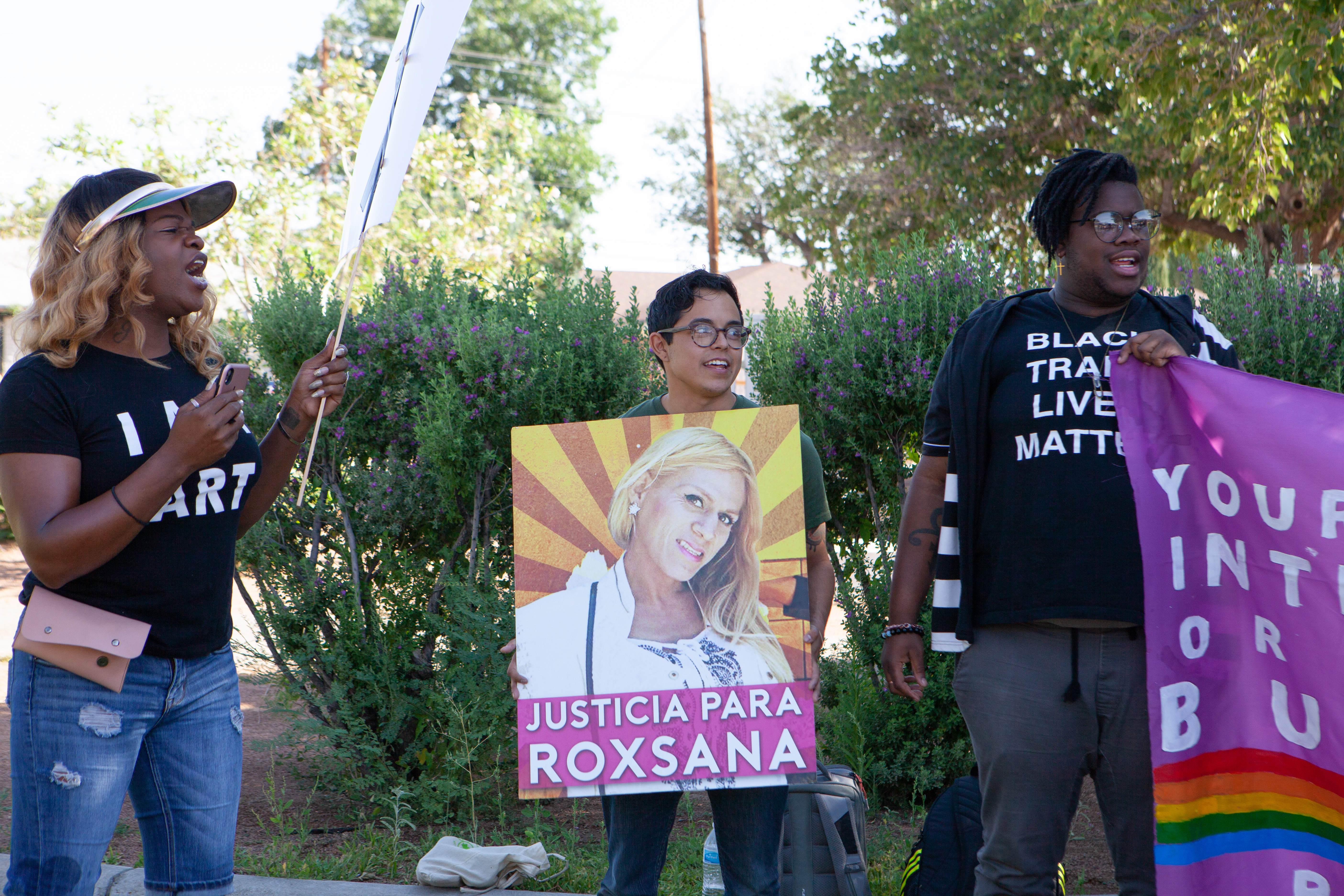 A protester holds a sign that reads 