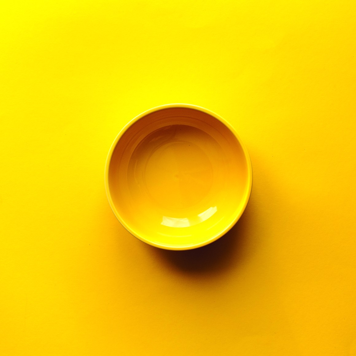 An empty yellow bowl.