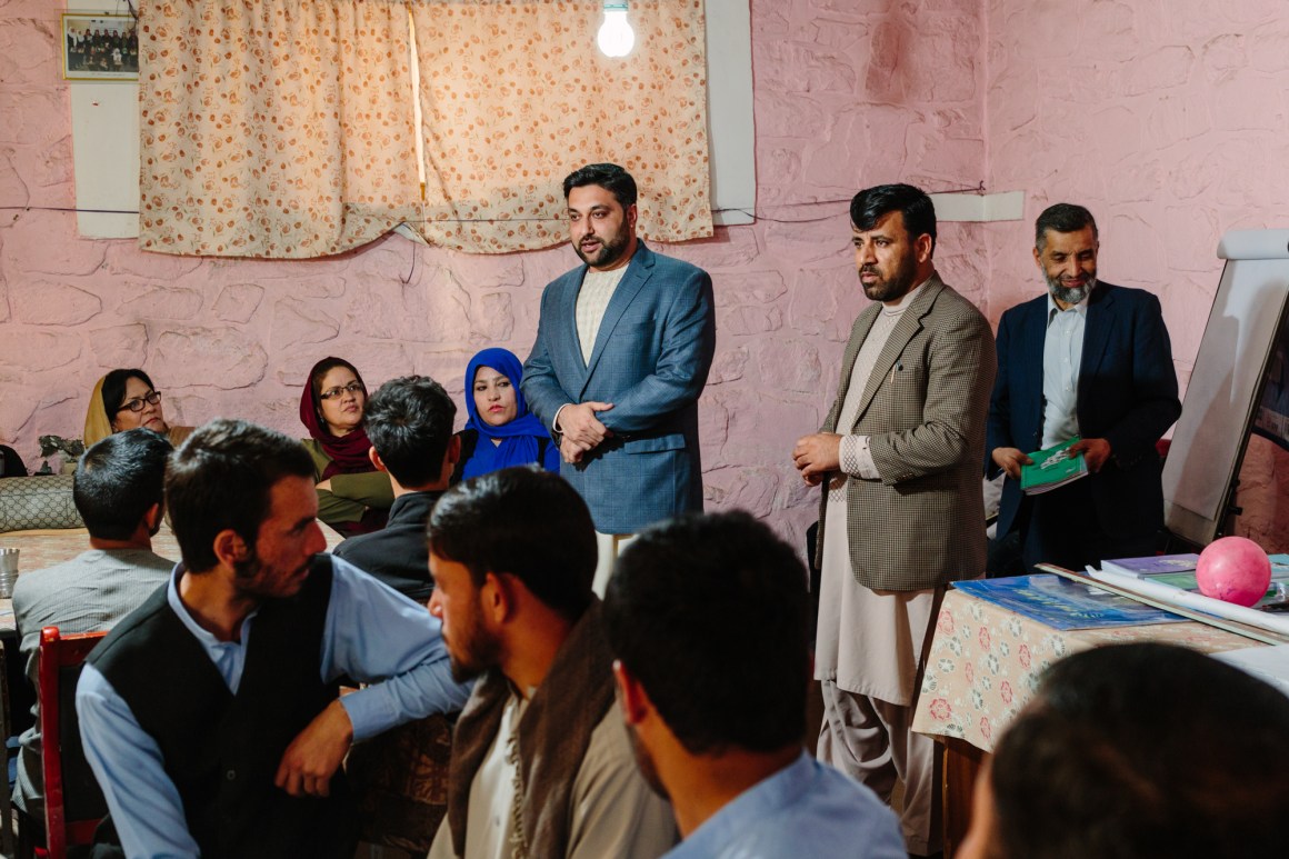 Nasib speaks with students and teachers at a youth organization in Kabul.