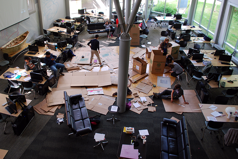 ANSEP Acceleration Academy students work on a STEM lab building cardboard canoes in the University of Alaska–Anchorage building dedicated for their use.