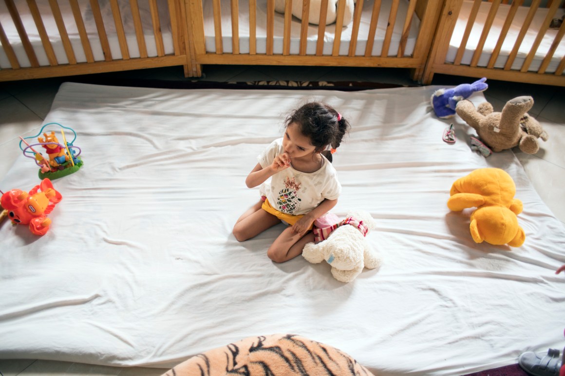 A child in bed at LMPE Marrakech.