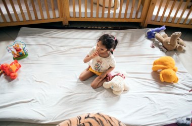 A child in bed at LMPE Marrakech.