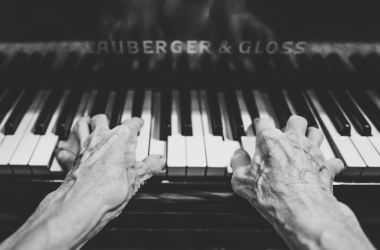 Elderly old people hands piano keyboard