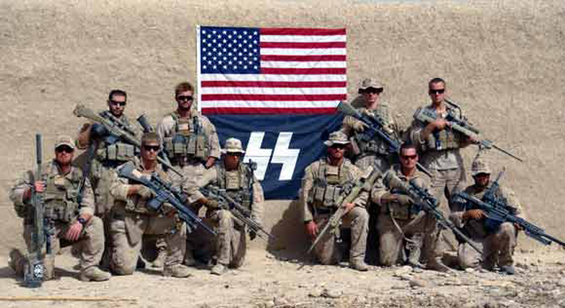 U.S. Marines pose with a SS Flag in 2012.